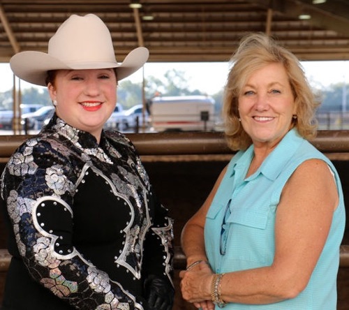 Chris with a student competing in Western Pleasure at OKC Horse Show